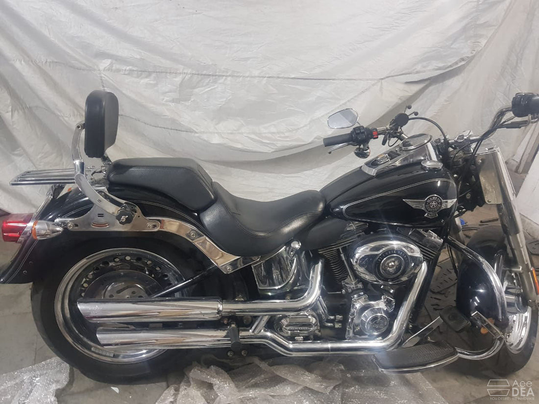 AeeDEA rider and pillion backrest installed behind the seat of a black cruiser motorcycle