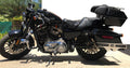 Front wheel of a motorcycle with a black mudslinger mounted near the fork