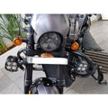 Front view of motorcycle showing adjustable highway footpegs mounted on the engine guard