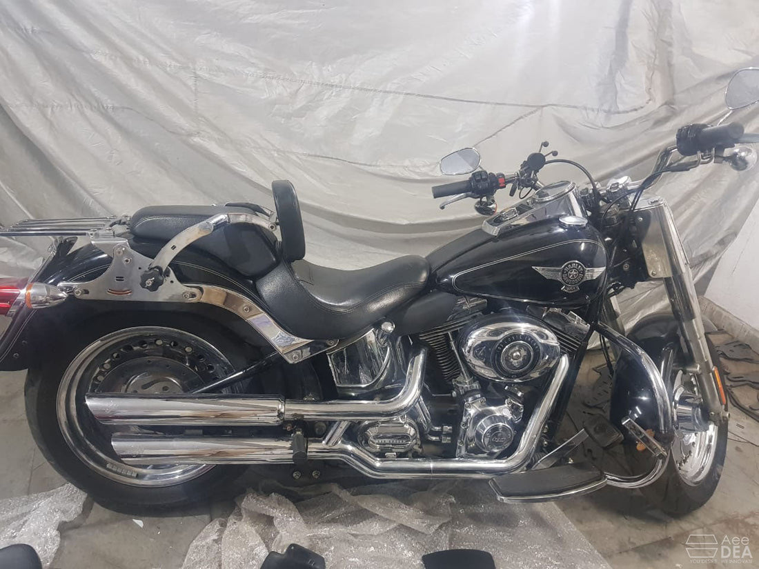 AeeDEA rider and pillion backrest installed behind the seat of a black cruiser motorcycle