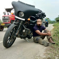 Motorcycle showing the Batwing fairing during an installation or adjustment demonstration