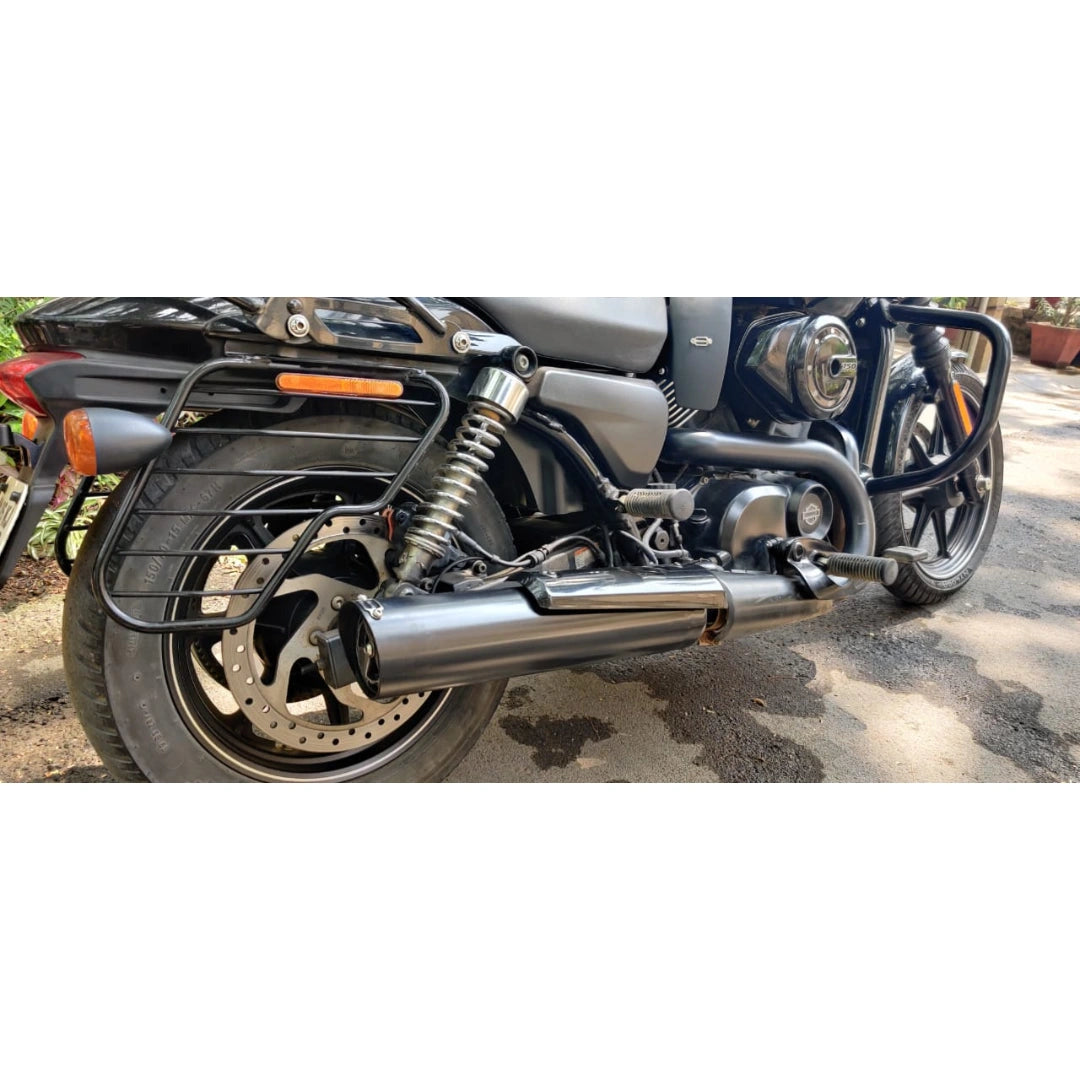 Rear side view of a motorcycle showing the installed AeeDEA exhaust beside the rear wheel