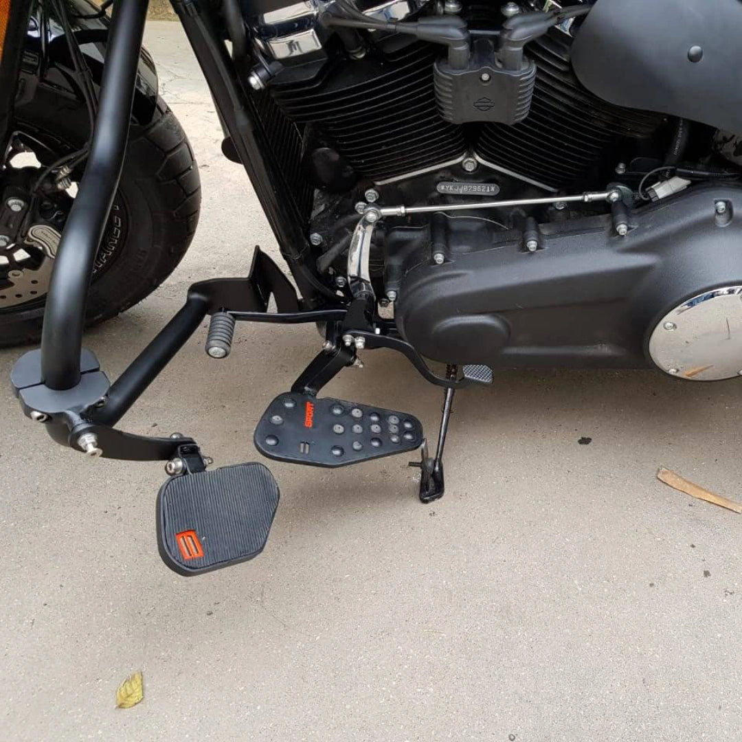 Forward control footboard installed beside the motorcycle engine
