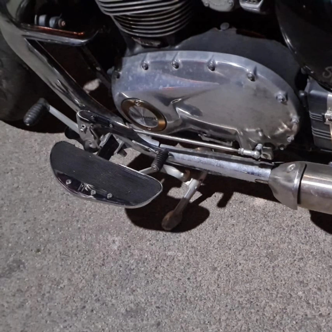 Side view of motorcycle showing its forward control footboard arrangement