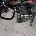 Motorcycle showing the forward control footboard fitted beside the engine