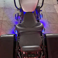 Rear view of motorcycle fitted with AeeDEA forward control footboards and blue accent lighting