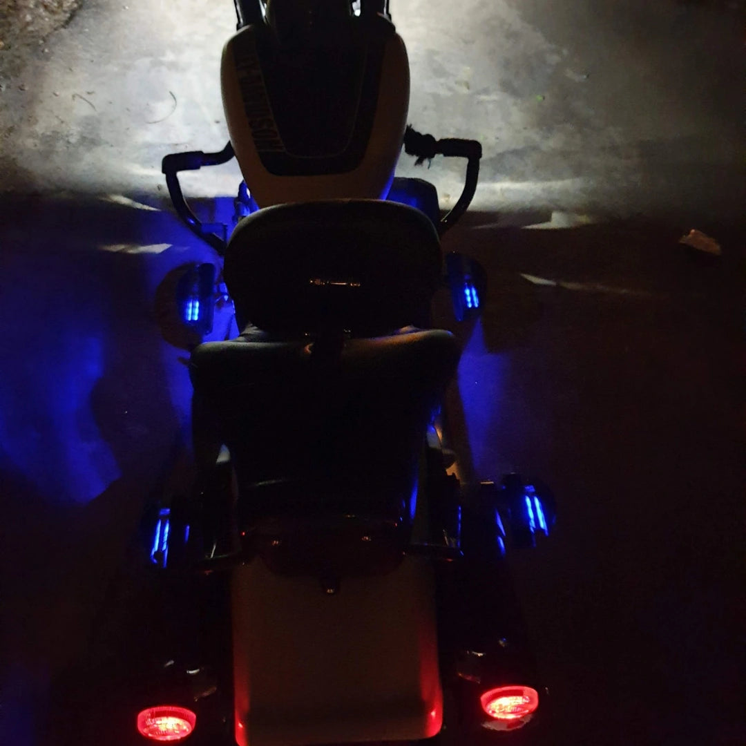 Rear view showing illuminated pillion footboards on both sides of the motorcycle