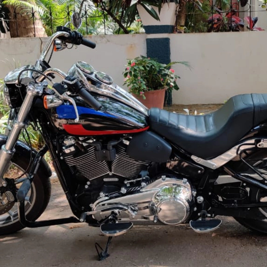 AeeDEA mid-mount rider footboards installed on a motorcycle