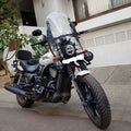 Front view of motorcycle fitted with an adjustable clear windshield