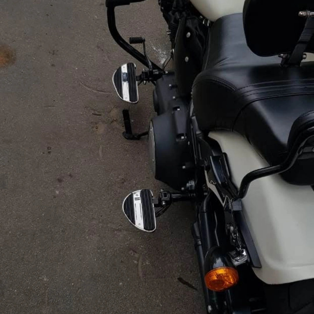Side view of motorcycle showing the foldable pillion footboard mounting position