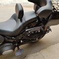 Close-up of rider footboard fitted beside the motorcycle frame