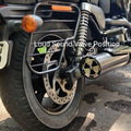 Close-up of the exhaust sound adjustment mechanism in the loud mode position