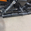 Close-up of the AeeDEA exhaust fitted along the lower side of a motorcycle