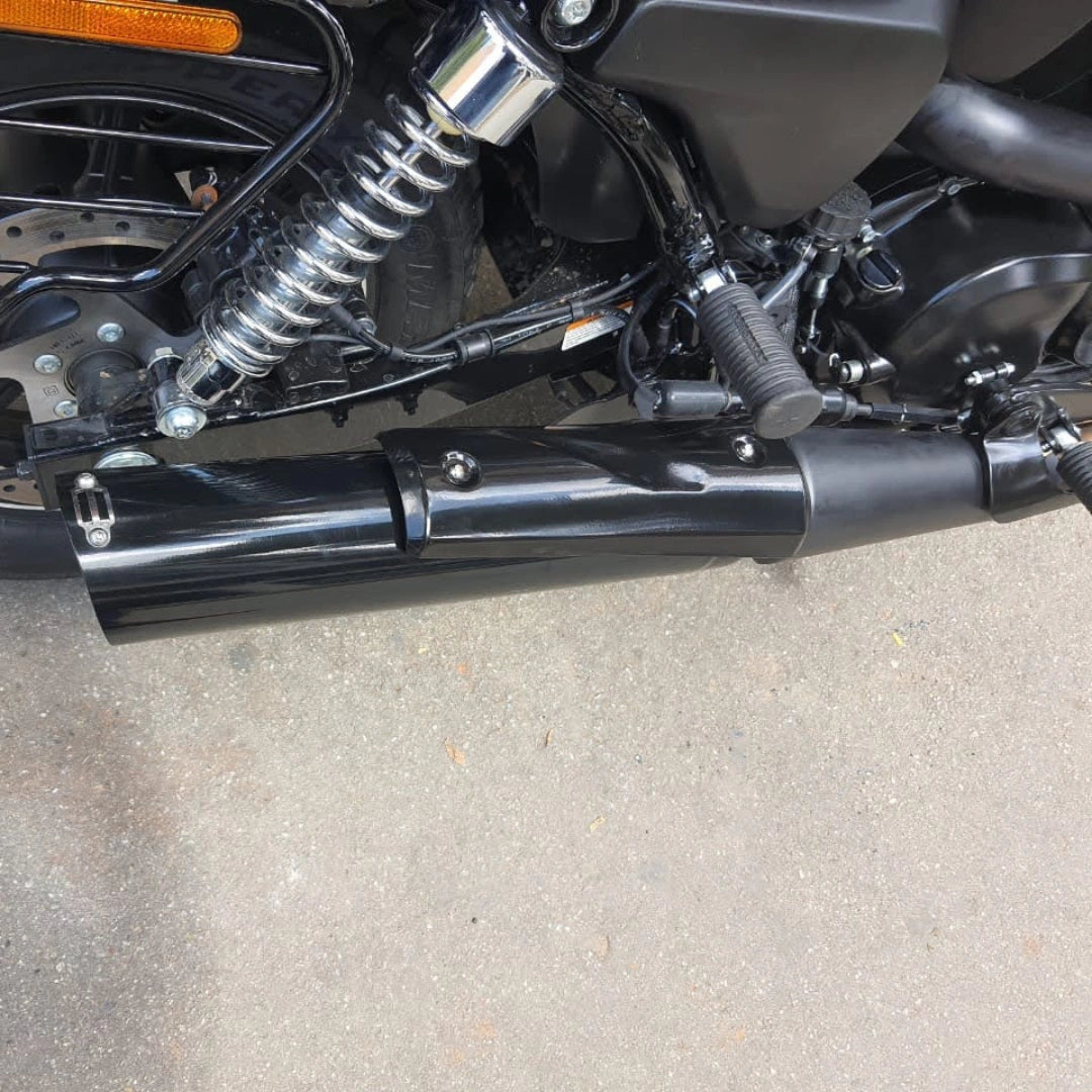 Close-up of the AeeDEA exhaust fitted along the lower side of a motorcycle