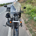 Front view of a motorcycle showing the clear windshield and mounting arrangement