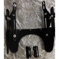 Rear view of the windshield mounting assembly showing its metal brackets and restrainers