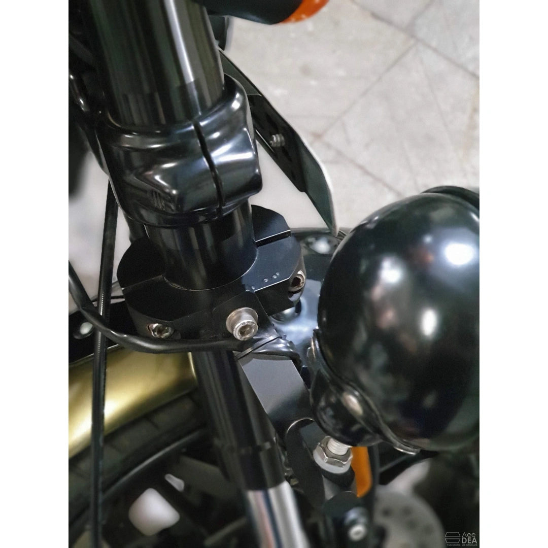 Close-up of the metal mounting bracket and auxiliary light assembly
