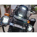 Close-up of auxiliary lights fitted around the motorcycle headlight