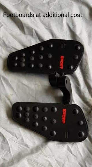 Pair of black rider footboards with raised grip points, shown as an optional accessory