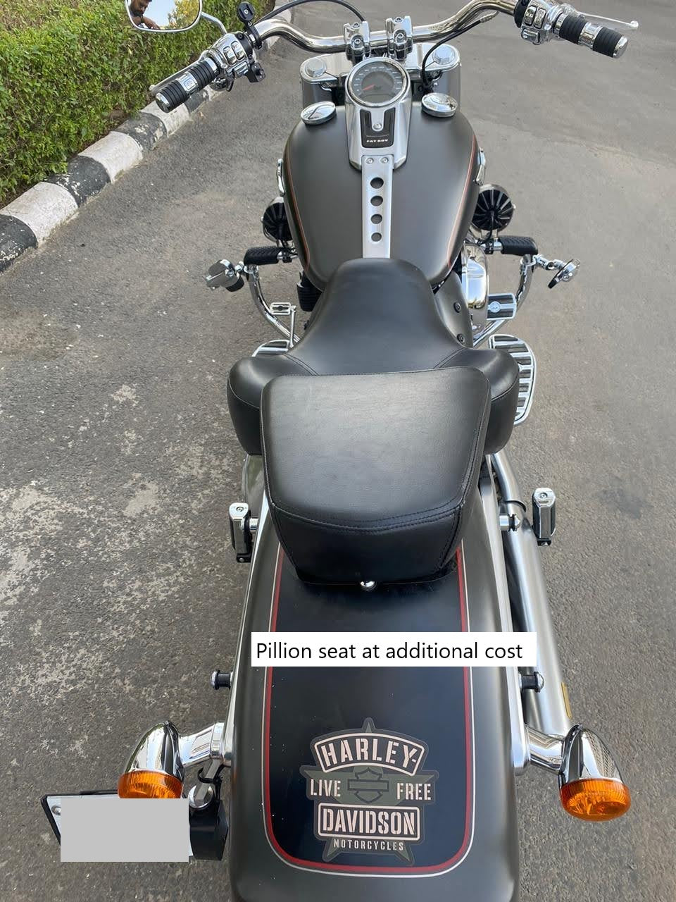 Deep-resting motorcycle seat and separate pillion seat fitted to a cruiser motorcycle; pillion seat available at additional cost
