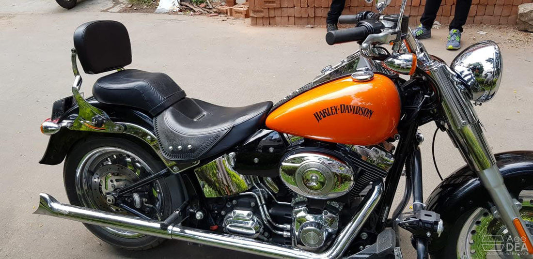 AeeDEA heat deflectors installed around the engine area of an olive-green cruiser motorcycle