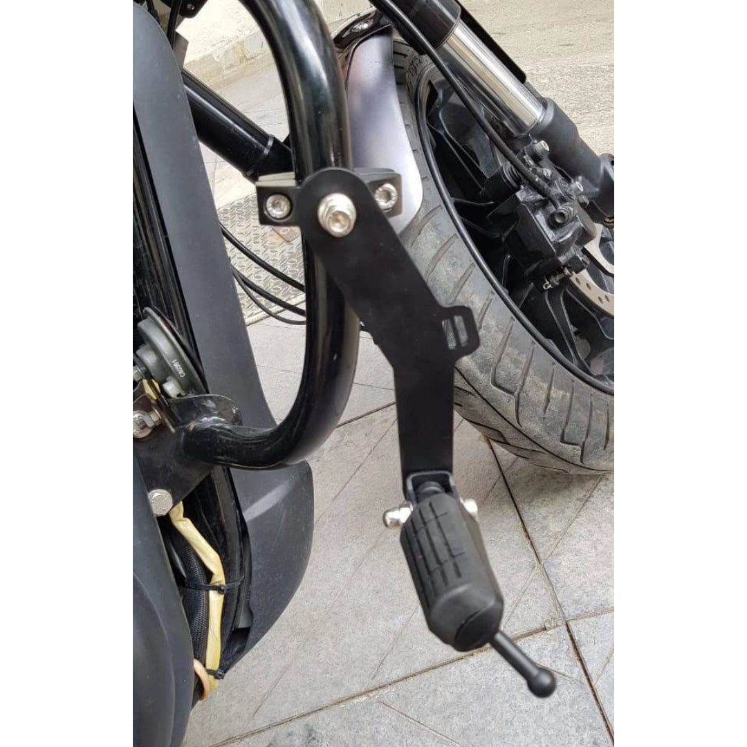 Close-up of a foldable black motorcycle highway footpeg and its mounting bracket
