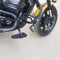 Motorcycle fitted with forward control footboards, shown from the rear