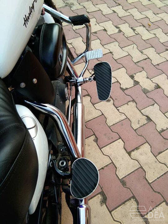Motorcycle with forward foot controls and wide rider footboards installed