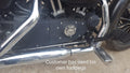 Forward foot controls installed on a motorcycle using the rider's existing footpegs