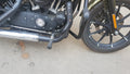 Side view of motorcycle forward foot controls mounted ahead of the engine