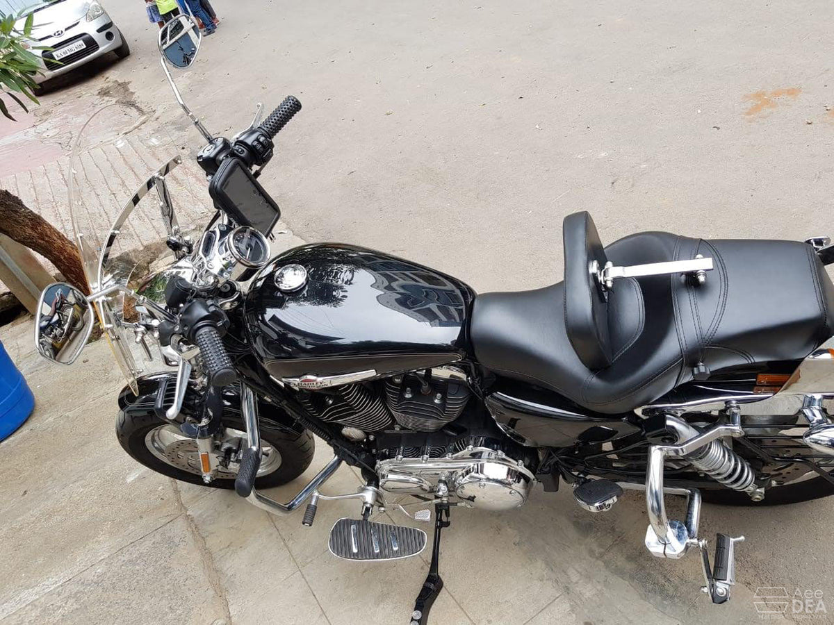 Motorcycle fitted with forward foot controls and wide chrome-edged rider footboards