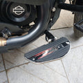 Close-up of motorcycle footboard with metallic side detailing