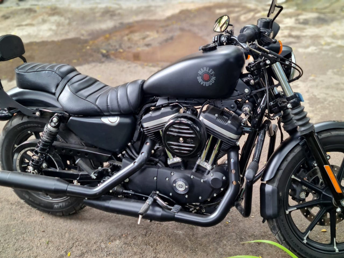Black motorcycle with a front mudslinger mounted around the front wheel