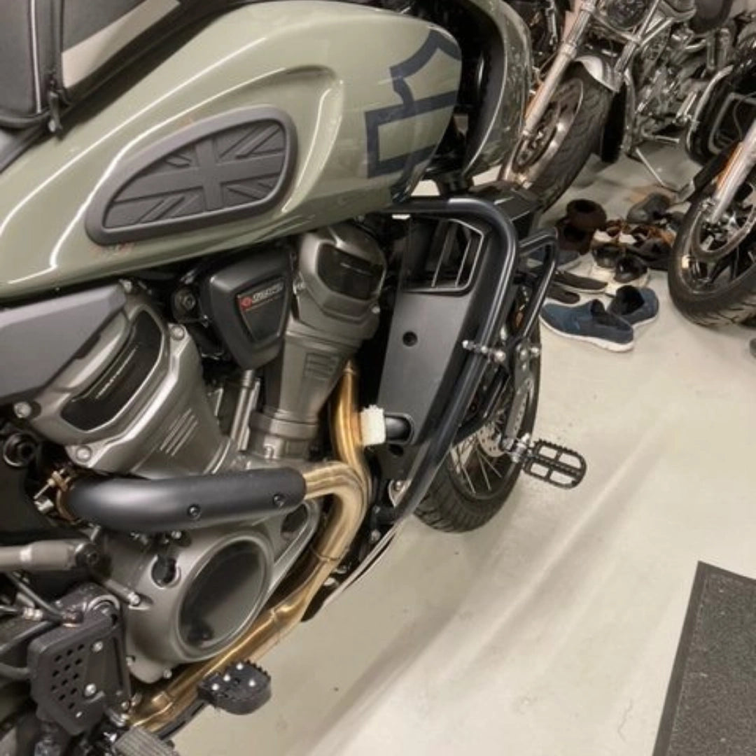 AeeDEA adjustable highway footpeg installed on a Harley-Davidson motorcycle