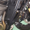 AeeDEA adjustable highway footpeg mounted near the Harley-Davidson crash bar