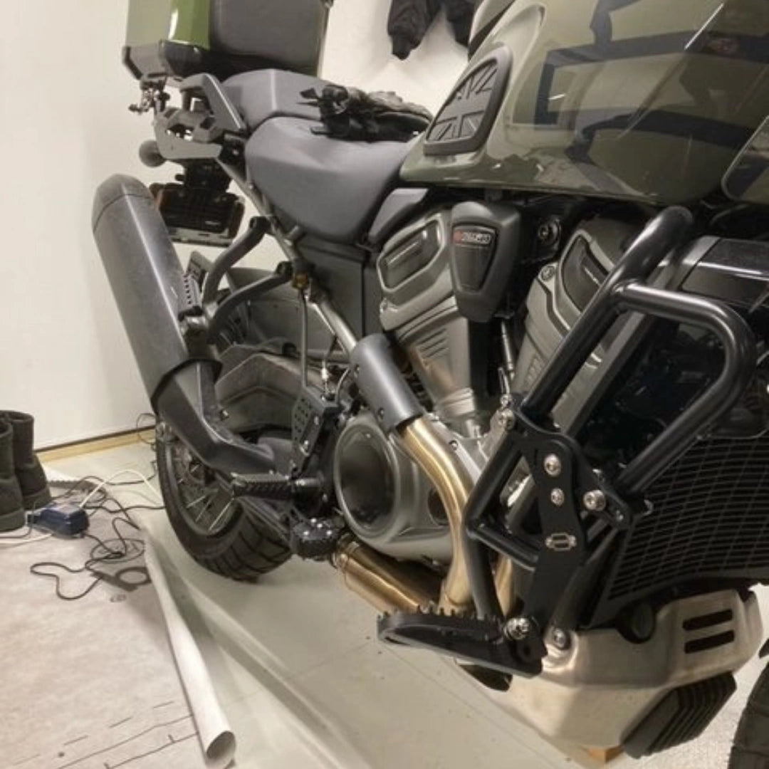 AeeDEA extended reach footpeg installed on a Harley-Davidson motorcycle