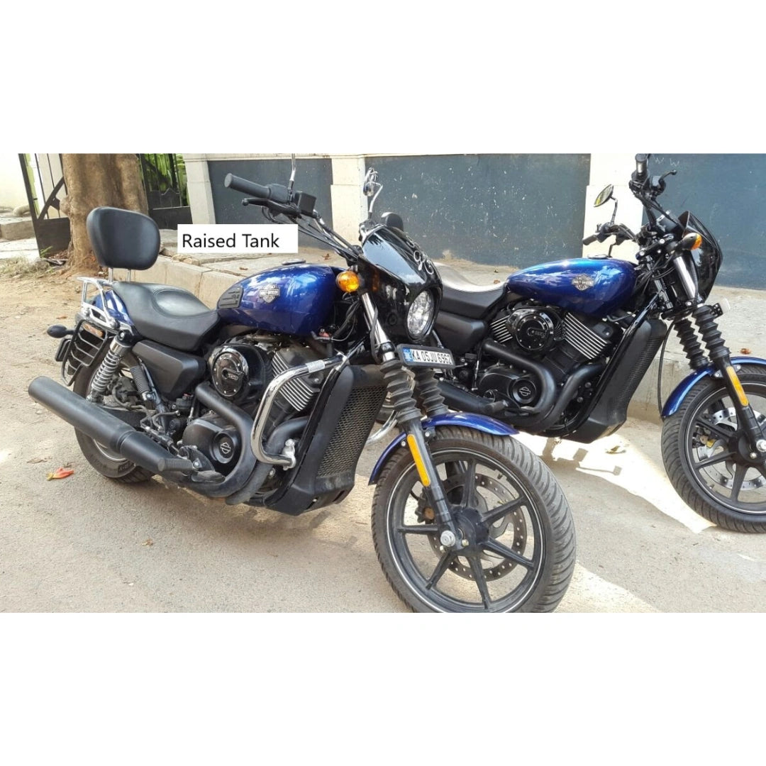 Side view of a blue Harley-Davidson motorcycle showing the raised tank profile