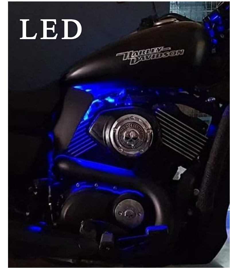 Pair of black motorcycle heat deflector shields illuminated by blue LED lighting