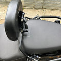 Close-up of the adjustable mounting bracket and spring mechanism on AeeDEA rider backrest