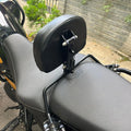 Side angle of AeeDEA adjustable rider backrest and mounting frame installed on Himalayan 450