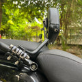 Close-up of the spring-loaded mechanism and mounting bracket on AeeDEA Himalayan 450 rider backrest