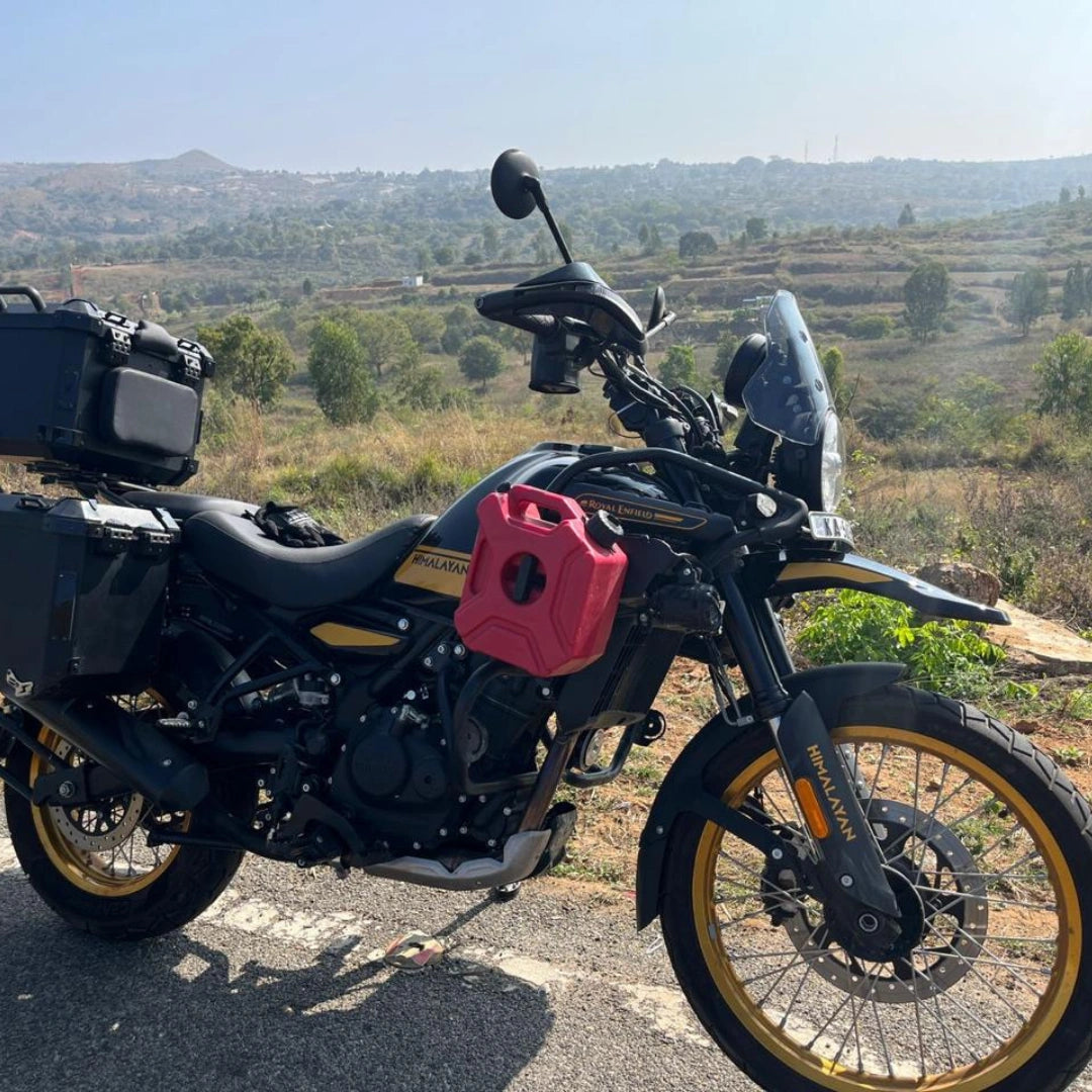 AeeDEA soft bag and jerry can holder mounted on Royal Enfield Himalayan 450 with a red fuel can
