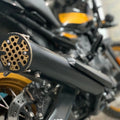 Close-up view of the AeeDEA concentric variable sound exhaust on Royal Enfield Himalayan 450