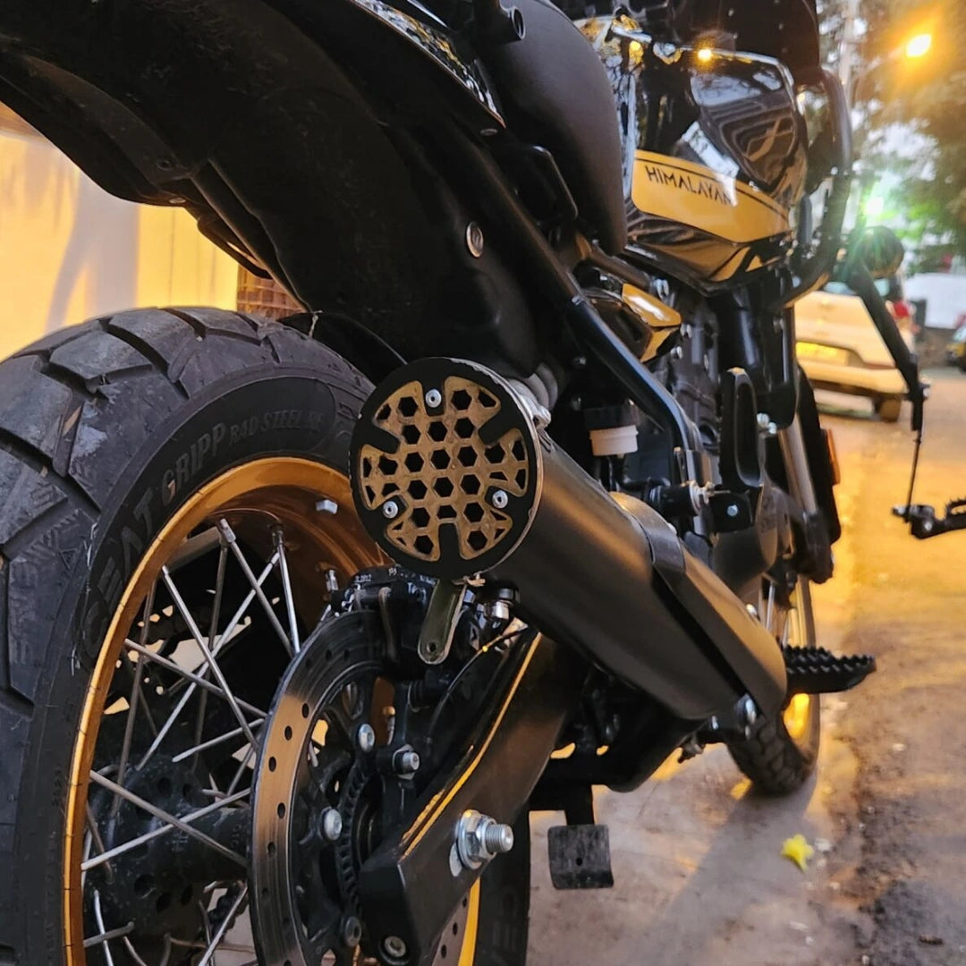 AeeDEA concentric variable sound exhaust installed on Royal Enfield Himalayan 450, rear-side view