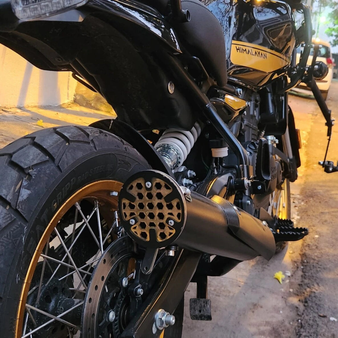 AeeDEA concentric variable sound exhaust installed on Royal Enfield Himalayan 450, rear-side view