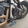 AeeDEA forward control footboard installed beside the motorcycle engine