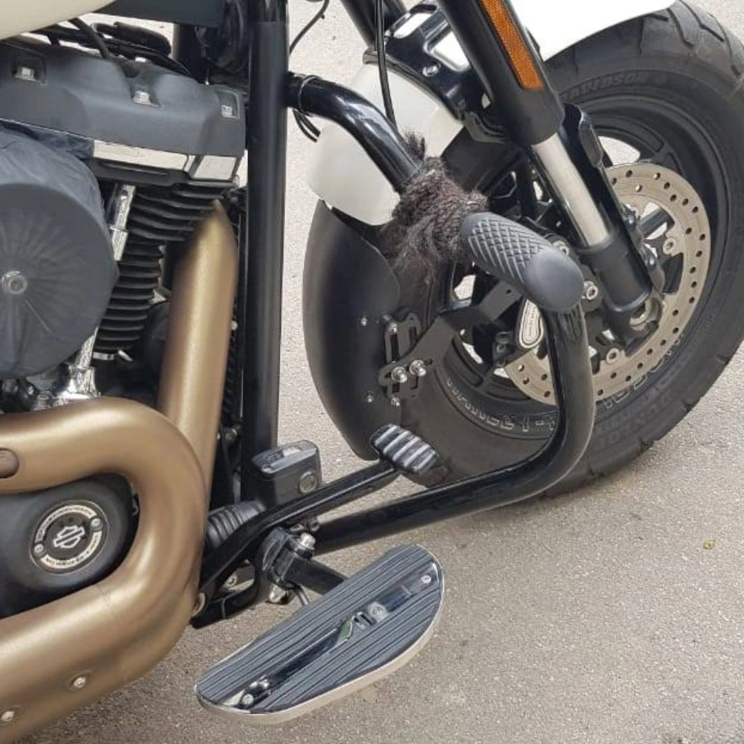 AeeDEA forward control footboard installed beside the motorcycle engine