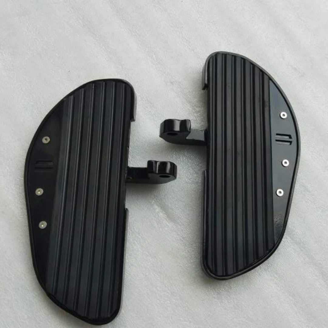 Close-up of the metal detailing and grip surface on a motorcycle footboard