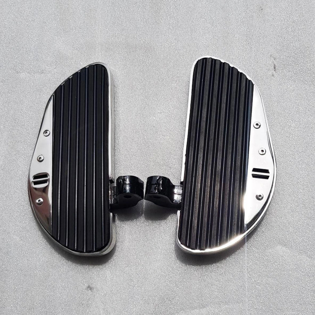 Pair of black jumbo motorcycle rider footboards shown separately