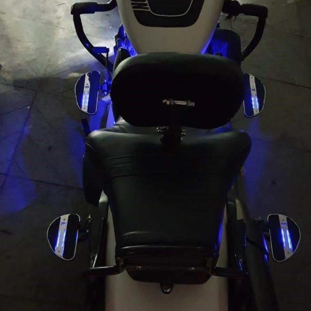 Rear view of motorcycle showing the rider seat and forward control footboard setup